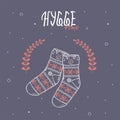 Hygge time with socks on blue background